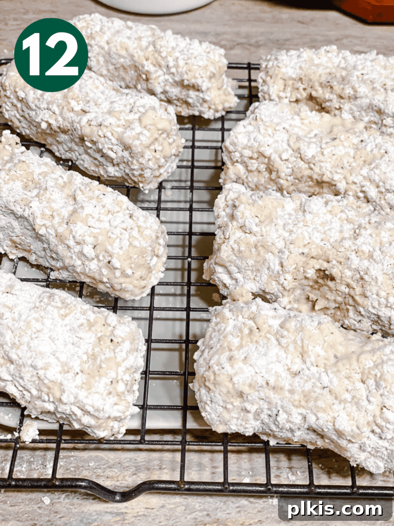 Crispy Tofu Chicken 15 process shot showing fully breaded tofu on a wire rack, ready for frying