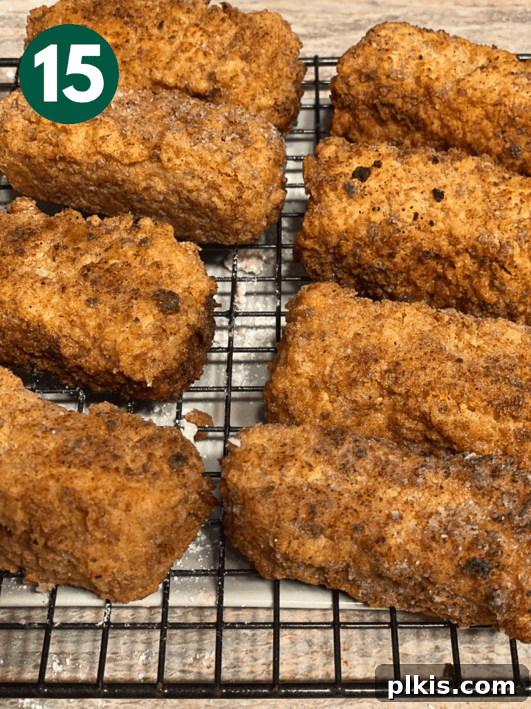 Crispy Tofu Chicken 18 completed Tofu Fried Chicken resting on a wire rack to drain excess oil