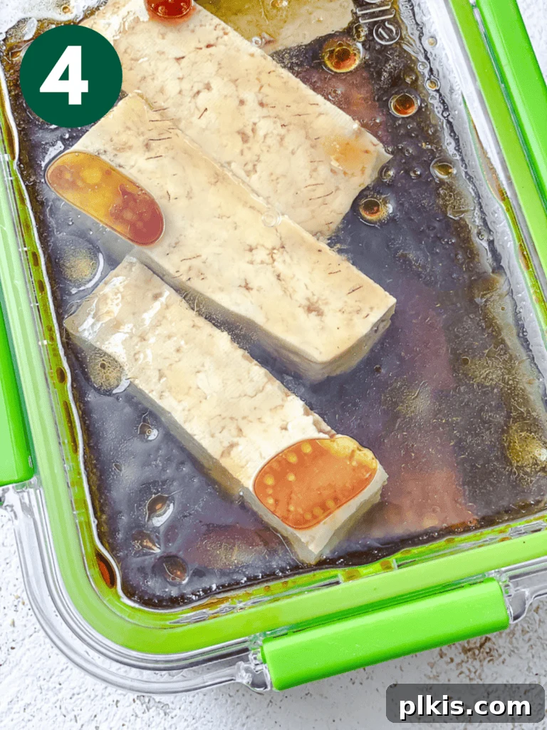 Crispy Tofu Chicken 7 process shot showing marinated tofu in a container