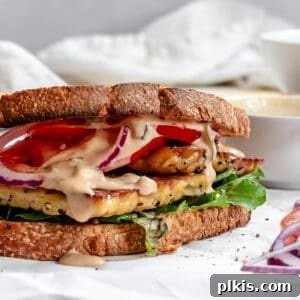 Savory Tempeh Sensation 17 Completed Tempeh Sandwich on a white surface, ideal for a quick and healthy meal.
