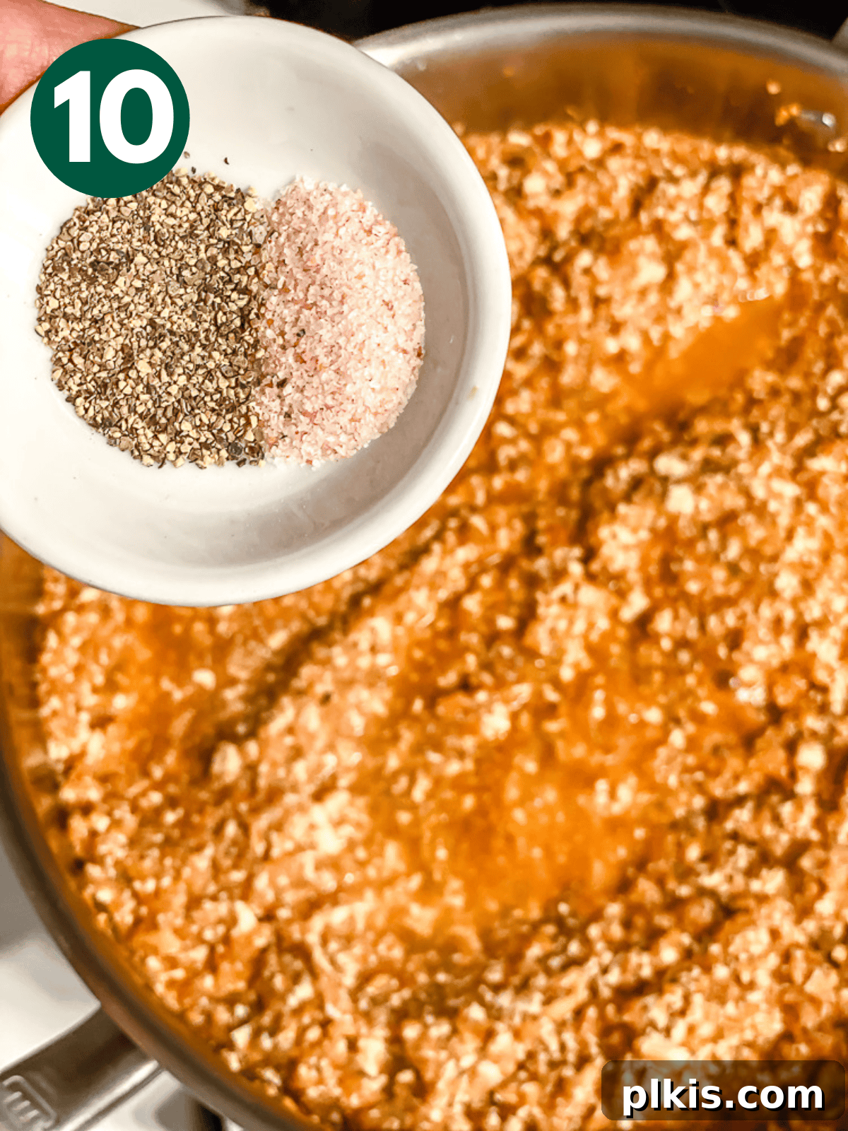 Chipotle Spiced Tofu 13 seasoning cooked sofritas in a metal pan with salt and pepper.