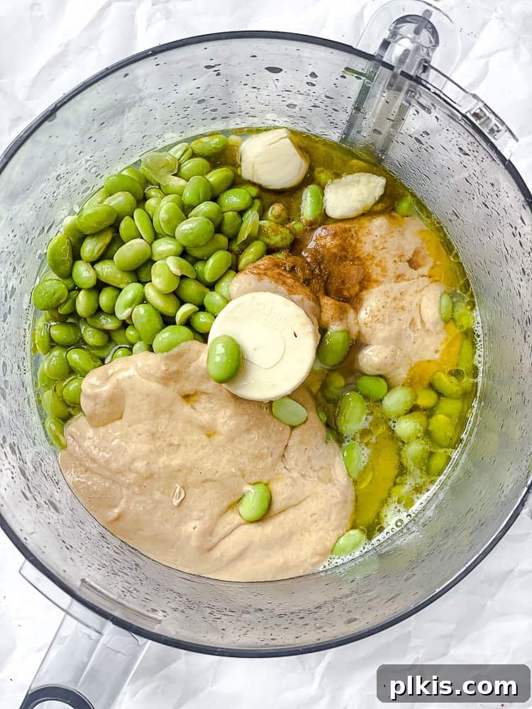 Emerald Edamame Delight 5 process shot showing adding ingredients to food processor