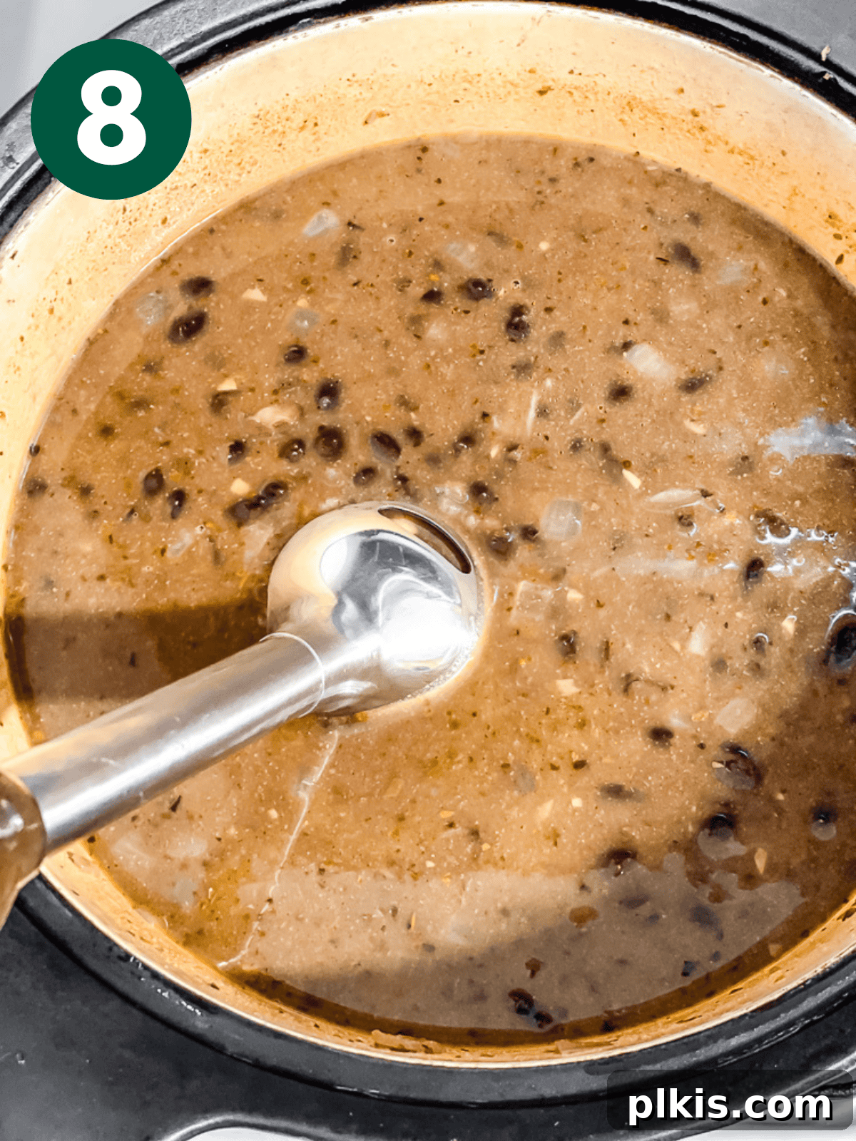 Spiced Black Bean Warmth 11 pureeing black bean soup with an immersion blender.
