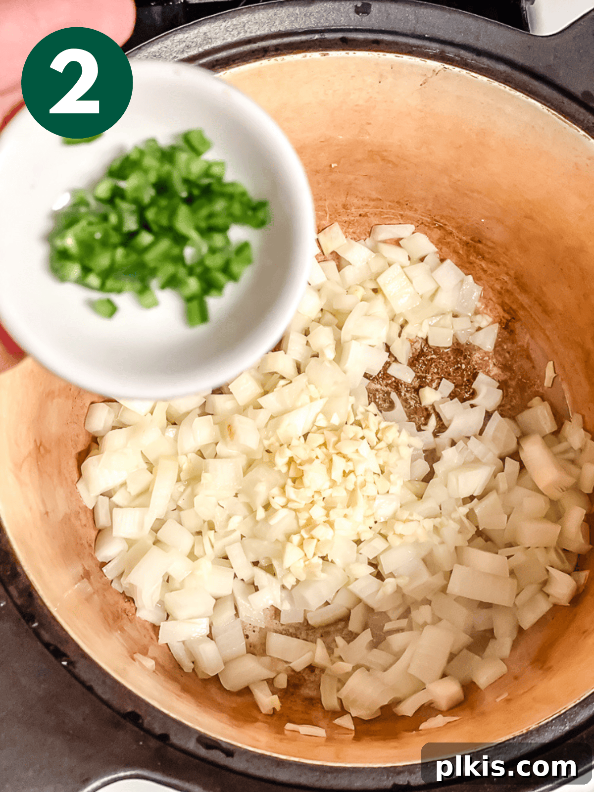 Spiced Black Bean Warmth 5 sautéing onions, garlic, and jalapenos in a large pot.