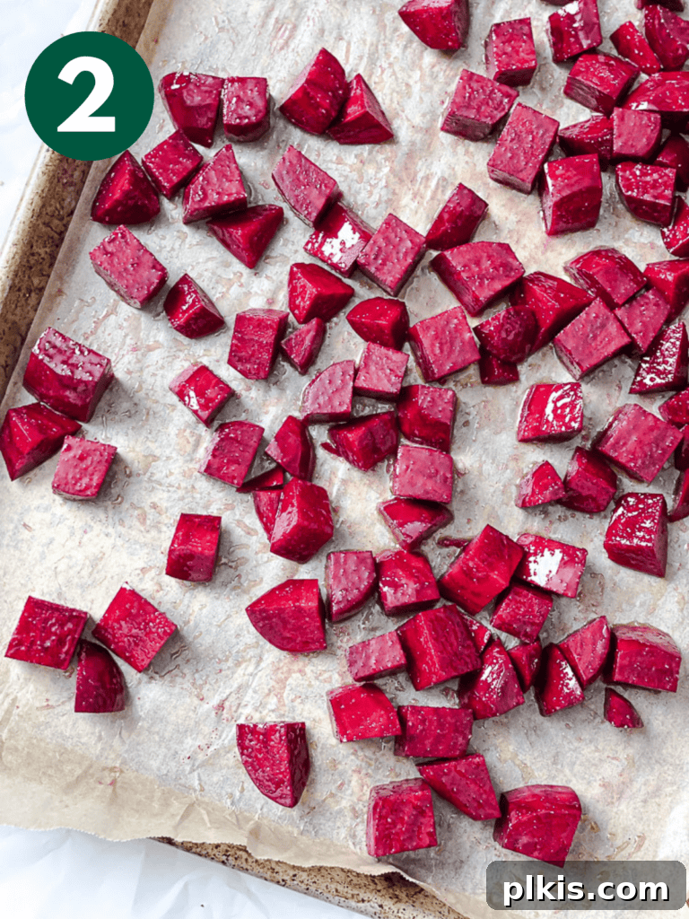 Vibrant Roasted Beet & Quinoa Medley 5 Process shot showing perfectly cooked and lightly charred roasted beets on a baking tray.