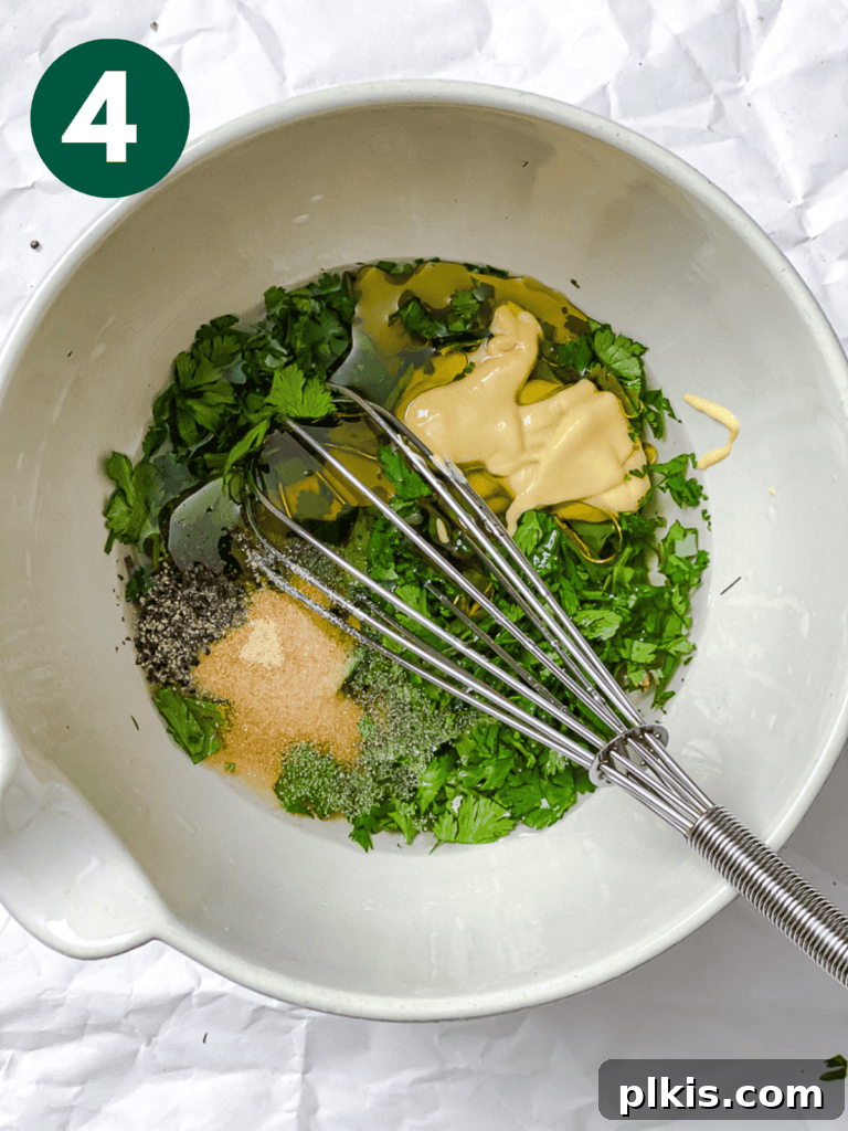 Vibrant Roasted Beet & Quinoa Medley 7 Process shot showing dressing ingredients being whisked together in a bowl.