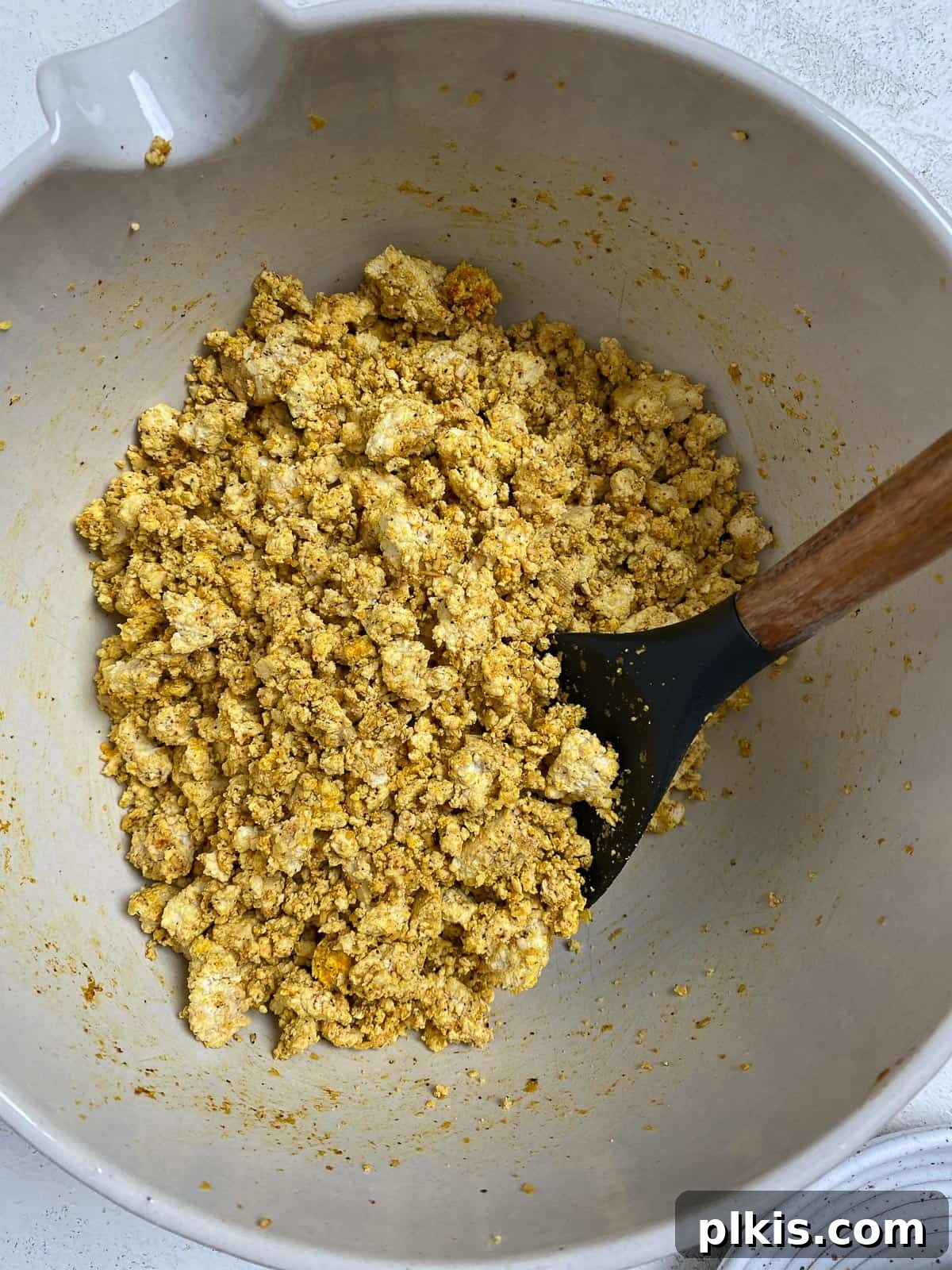 Effortless Plant-Based Breakfast Wrap 6 process shot of mixing tofu mixture in bowl