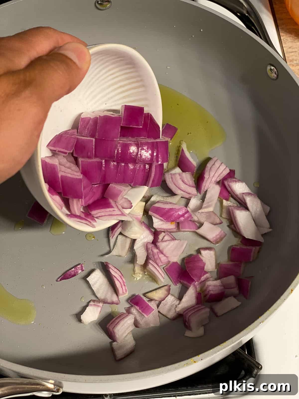 Effortless Plant-Based Breakfast Wrap 7 process shot of adding onions to bowl