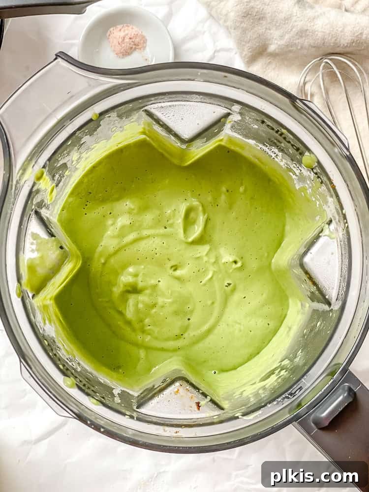 Emerald Pea Pasta 6 Process shot demonstrating the blended green pea sauce in a high-speed blender, showcasing its smooth and creamy texture.