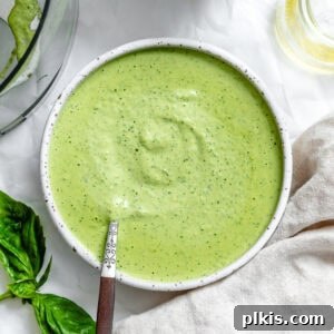 smooth vegan pesto in a white bowl.