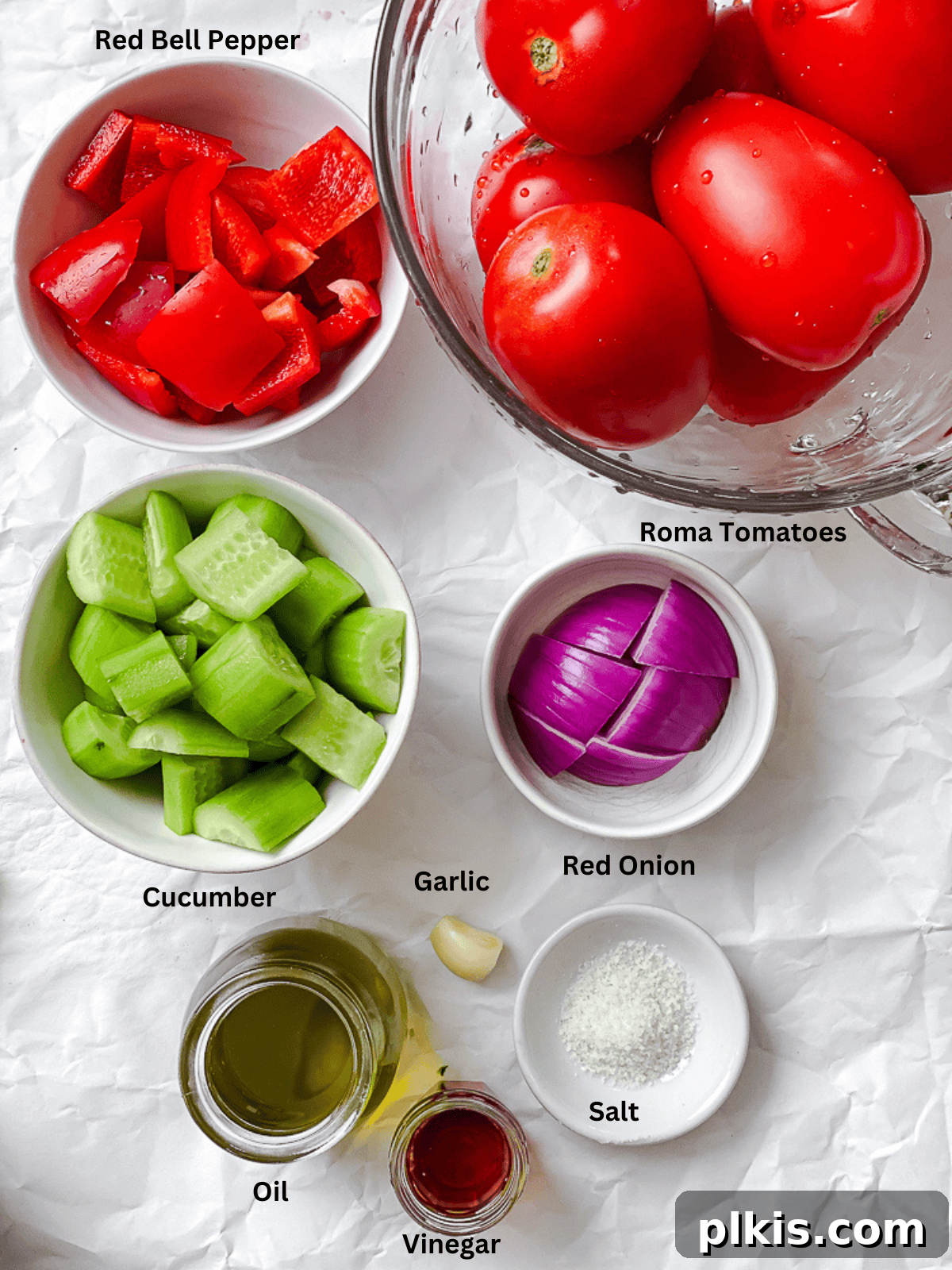 Vibrant Summer Gazpacho 3 ingredients for Tomato Gazpacho measured out on a white surface
