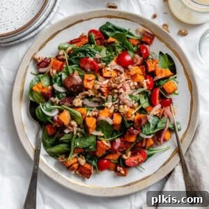 Warm Roasted Sweet Potato Salad 10 A perfectly prepared serving of Roasted Sweet Potato Salad on a plate, ready to be enjoyed.