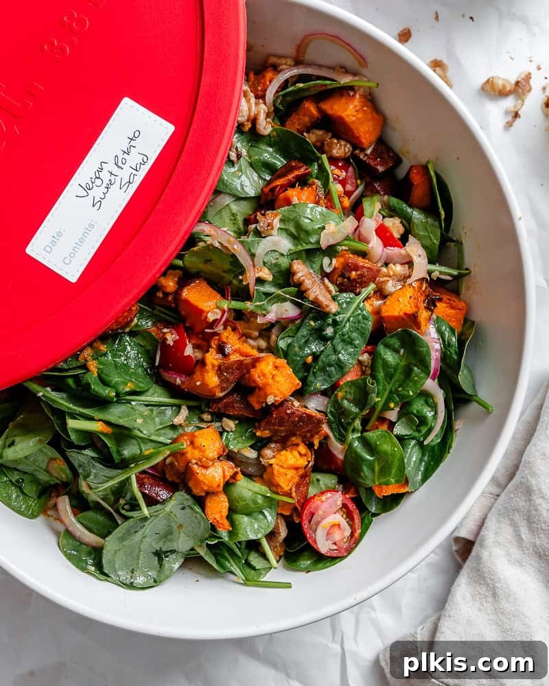 Warm Roasted Sweet Potato Salad 9 Roasted Sweet Potato Salad neatly packed in a clear glass storage container, ready for convenient meal prep.