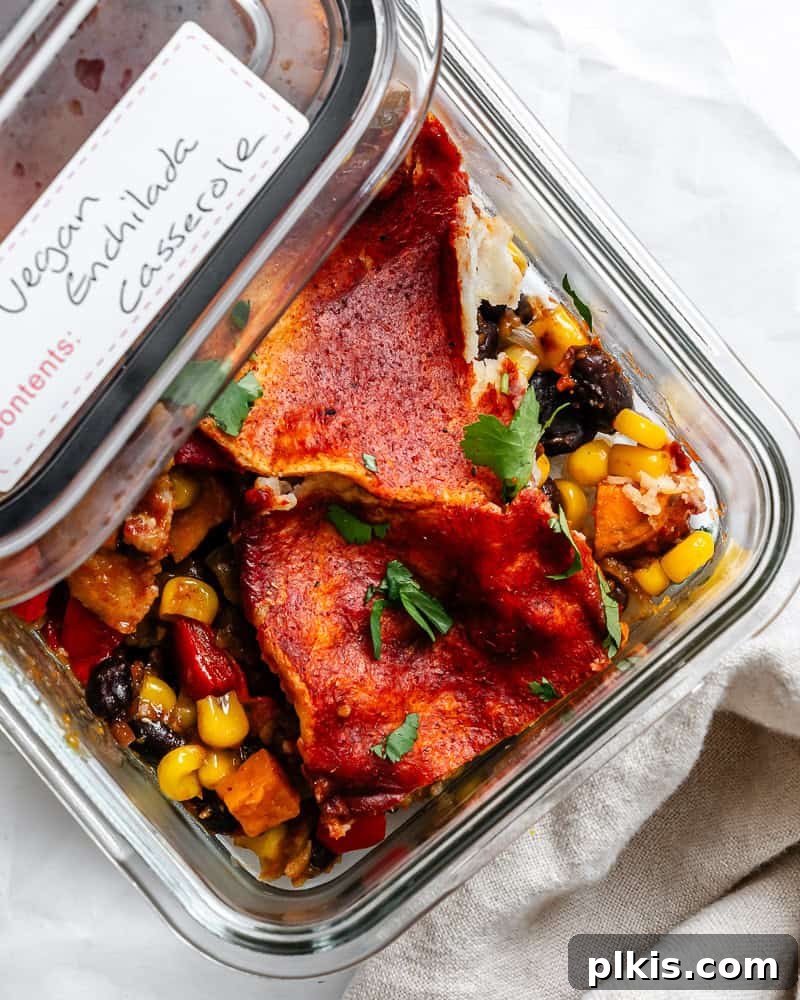 Plant-Powered Enchilada Layers 10 completed Vegetarian Enchilada Casserole in storage dish