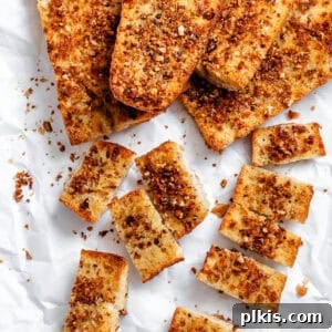 Effortless Plant-Based Garlic Bread 12 Several Easy Vegan Garlic Bread pieces on white surface
