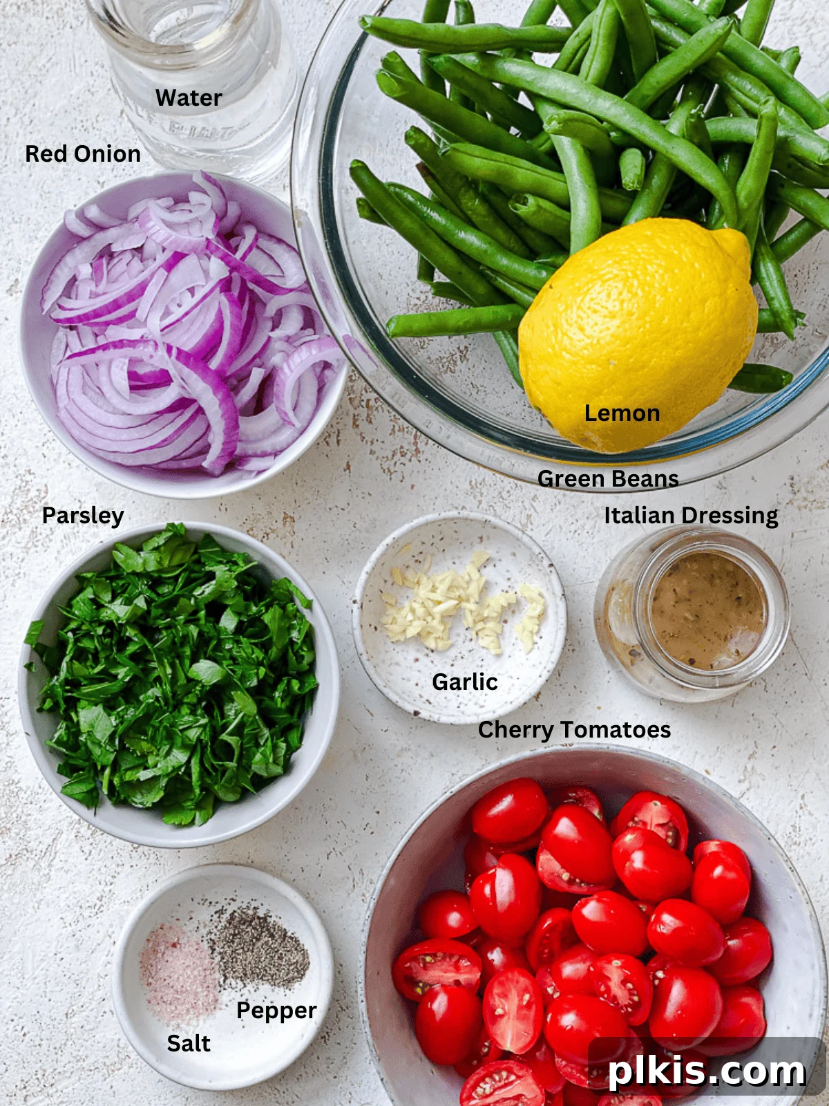 Zesty Green Bean Salad 3 ingredients for Green Bean Salad measured out on a counter