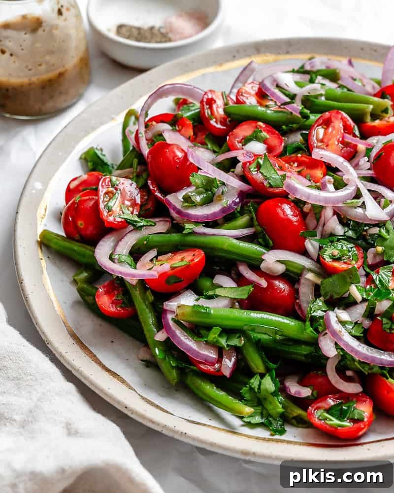Zesty Green Bean Salad 7 completed Green Bean Salad plated with extra dressing on the side