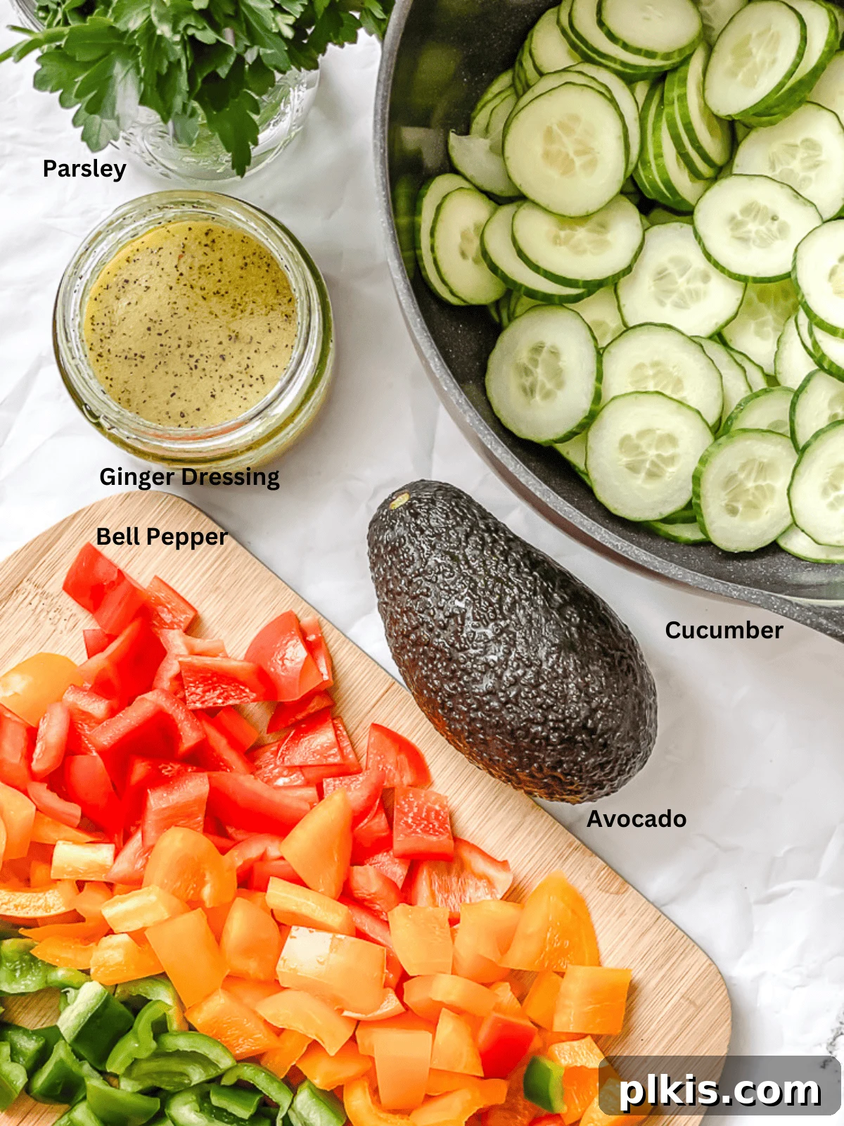 Crisp Cucumber and Pepper Medley 3 Fresh ingredients for Cucumber and Bell Pepper Salad neatly arranged and measured out, ready for preparation.