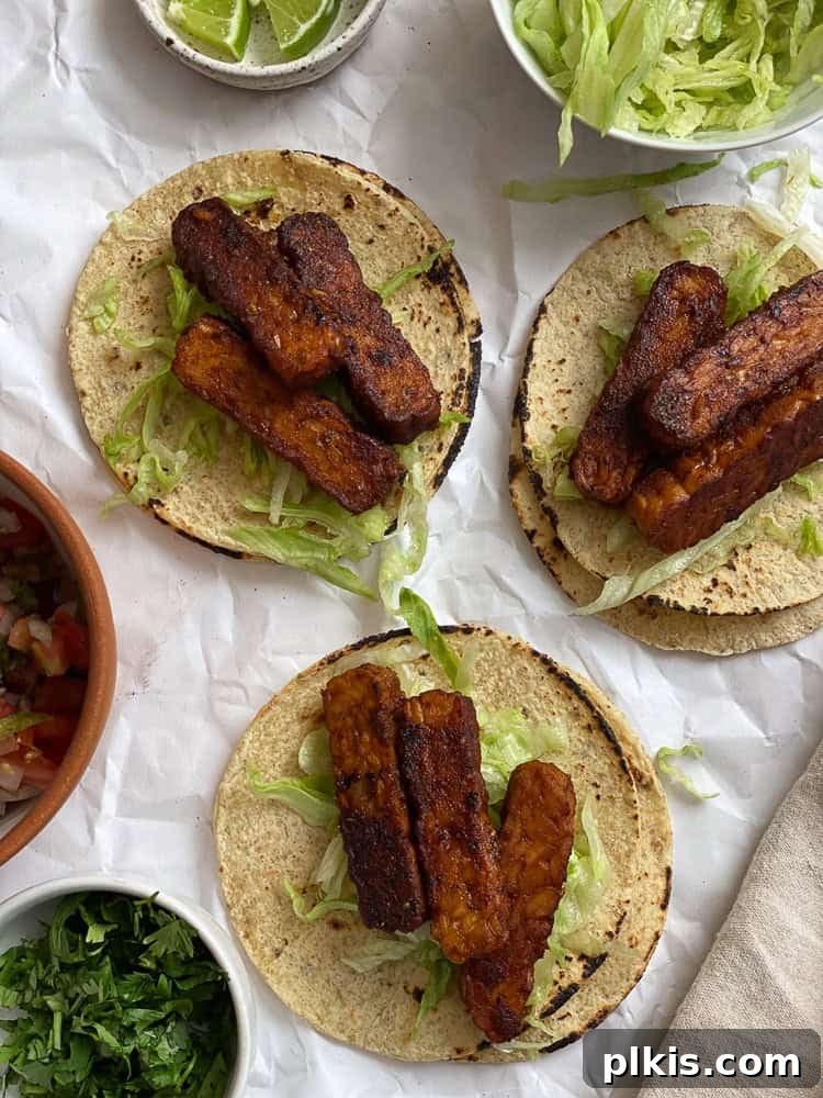 Speedy Tempeh Tacos 6 Process shot showing the final assembly of Easy Tempeh Tacos with toppings