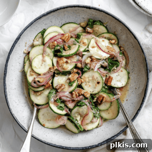 Zesty Zucchini Salad 12 Completed Raw Zucchini Salad plated beautifully in a serving bowl.