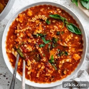 vegan lasagna soup in a white bowl.