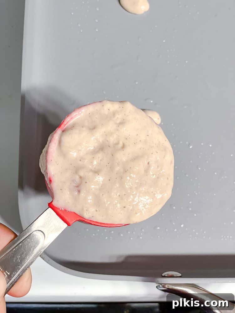 Fluffy Strawberry Pancakes 8 process shot showing adding batter to pan