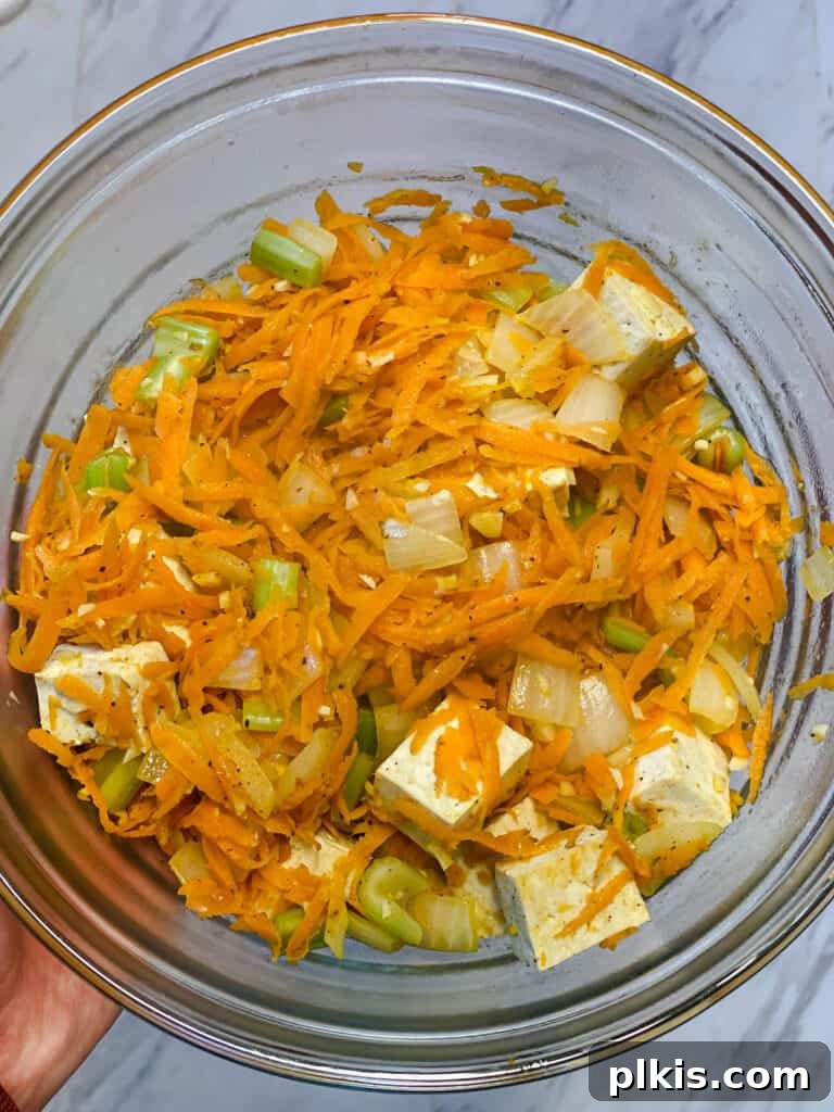 Filipino Pancit Bihon Noodles 11 process shot of veggies and tofu added to glass bowl
