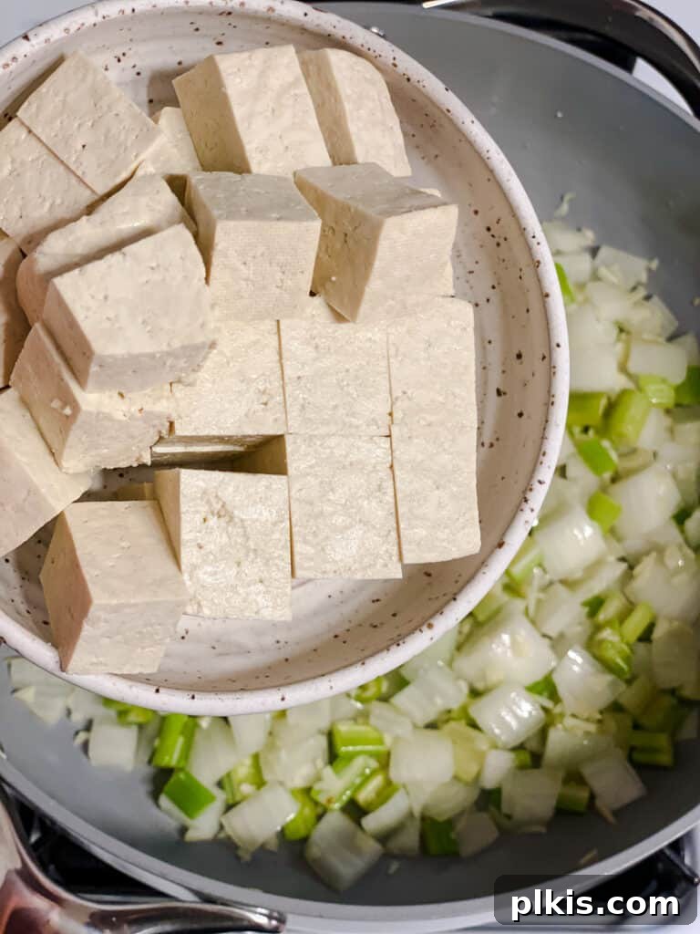 Filipino Pancit Bihon Noodles 8 process shot of adding tofu to pan