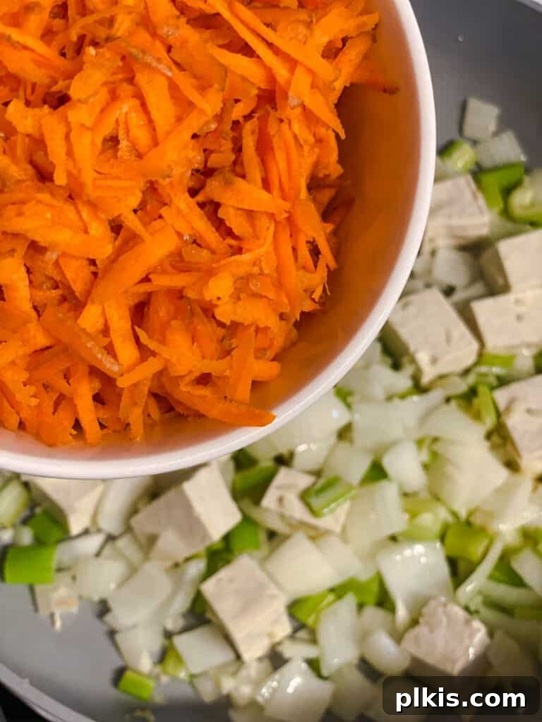 Filipino Pancit Bihon Noodles 9 process shot of adding carrots to pan