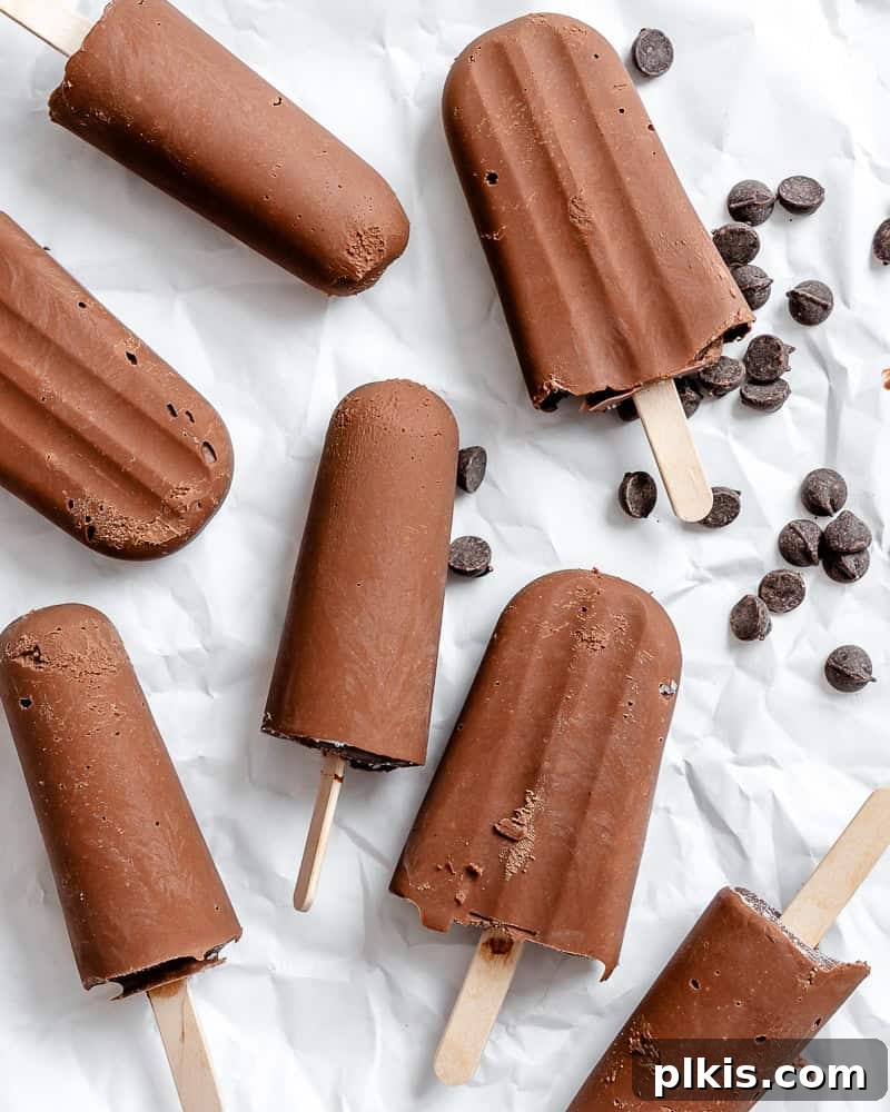 Decadent Dairy-Free Fudge Pops 2 completed Vegan Fudgesicles on a white surface