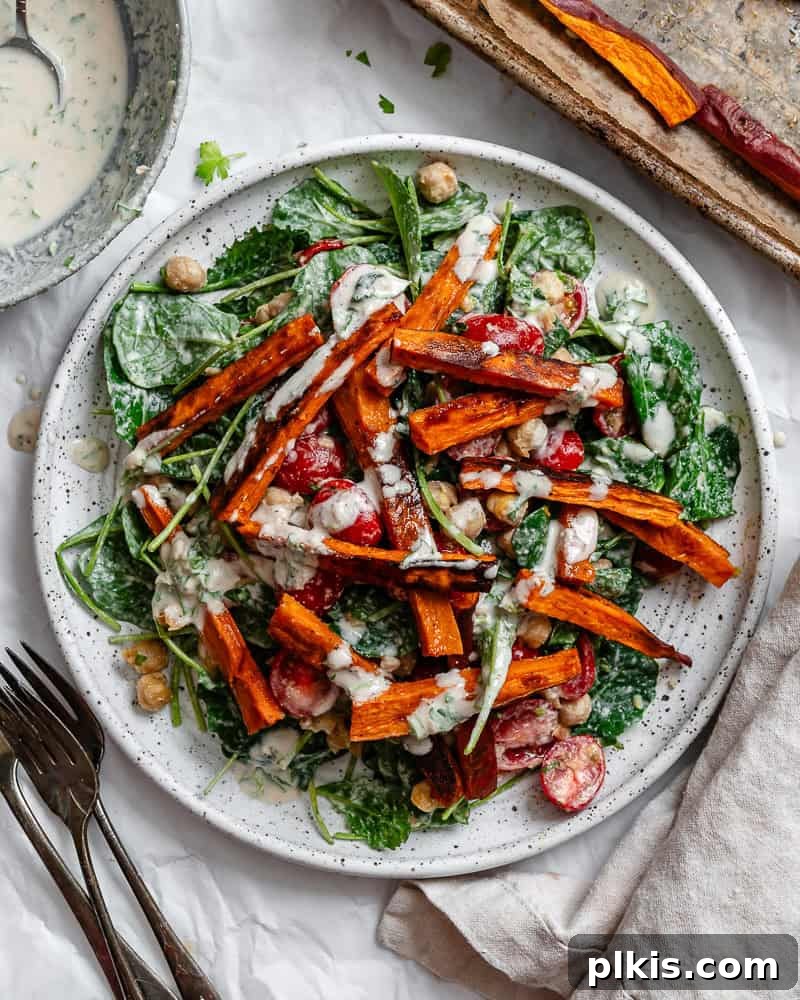 Vibrant Sweet Potato Kale Salad 2 Beautifully plated Roasted Sweet Potato and Kale Salad with chickpeas and tahini dressing.