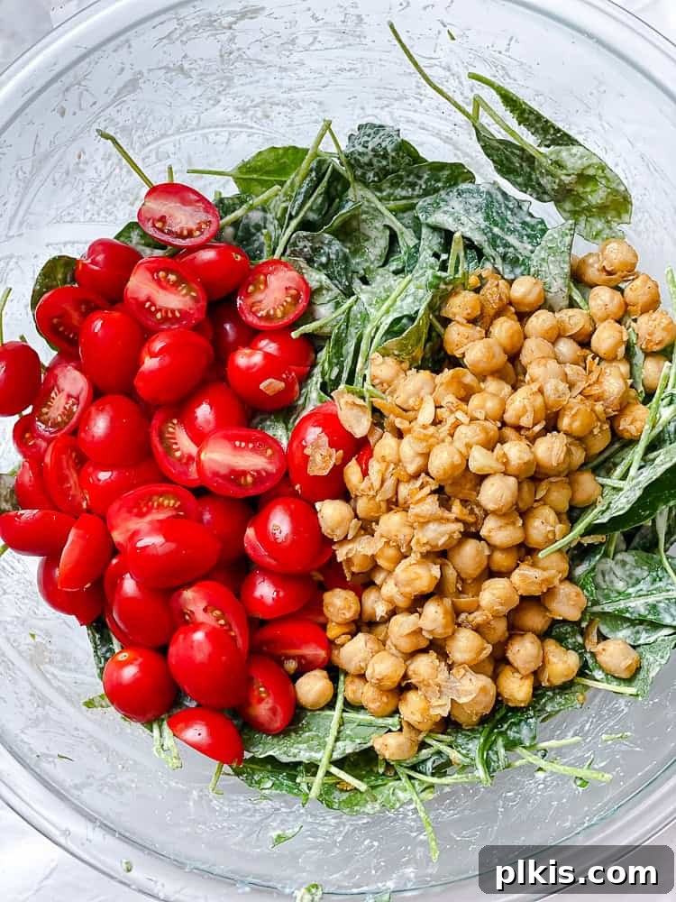 Vibrant Sweet Potato Kale Salad 8 Process shot showing all the main ingredients combined in a large salad bowl.