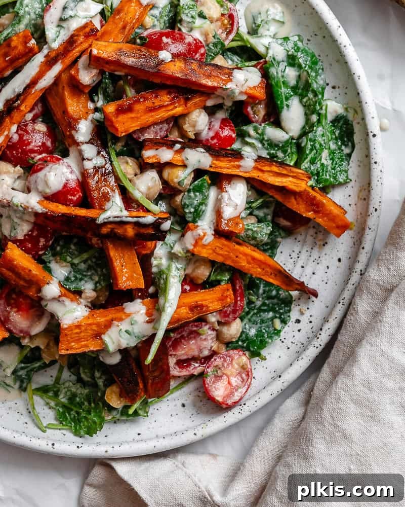 Vibrant Sweet Potato Kale Salad 9 Another view of the completed Roasted Sweet Potato and Kale Salad plated, showing its vibrant colors.