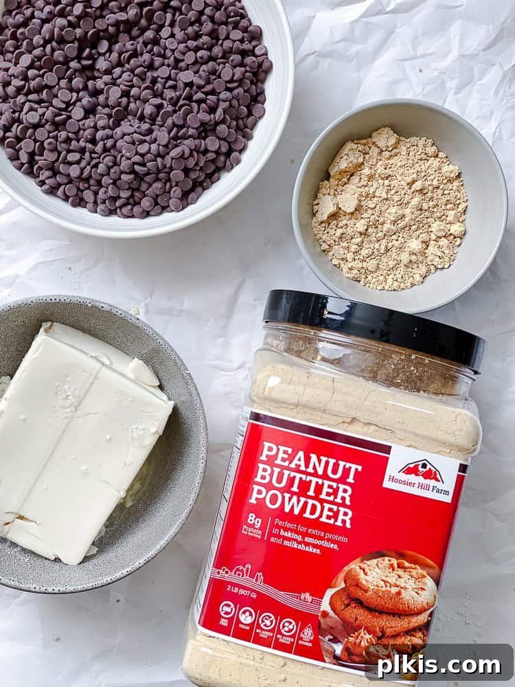 Protein-Packed Chocolate Peanut Butter Pops 3 Key ingredients for Chocolate Peanut Butter Protein Popsicles: vegan chocolate chips, silken tofu, and peanut butter powder.