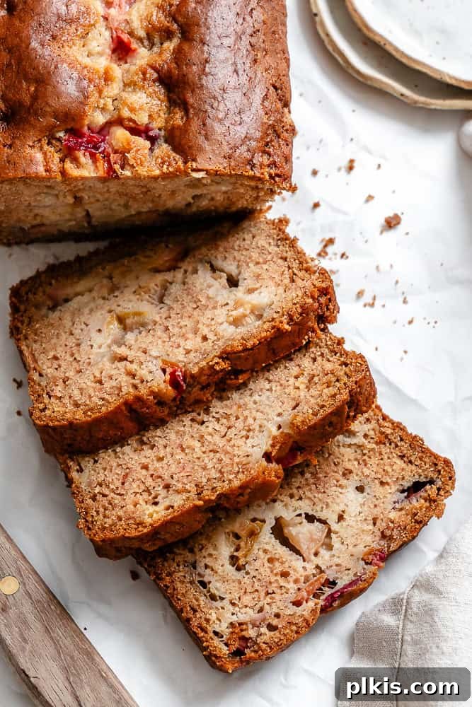 Golden Apricot Quick Bread 2 Beautifully baked Easy Apricot Bread on a white serving surface, ready to be sliced and enjoyed.