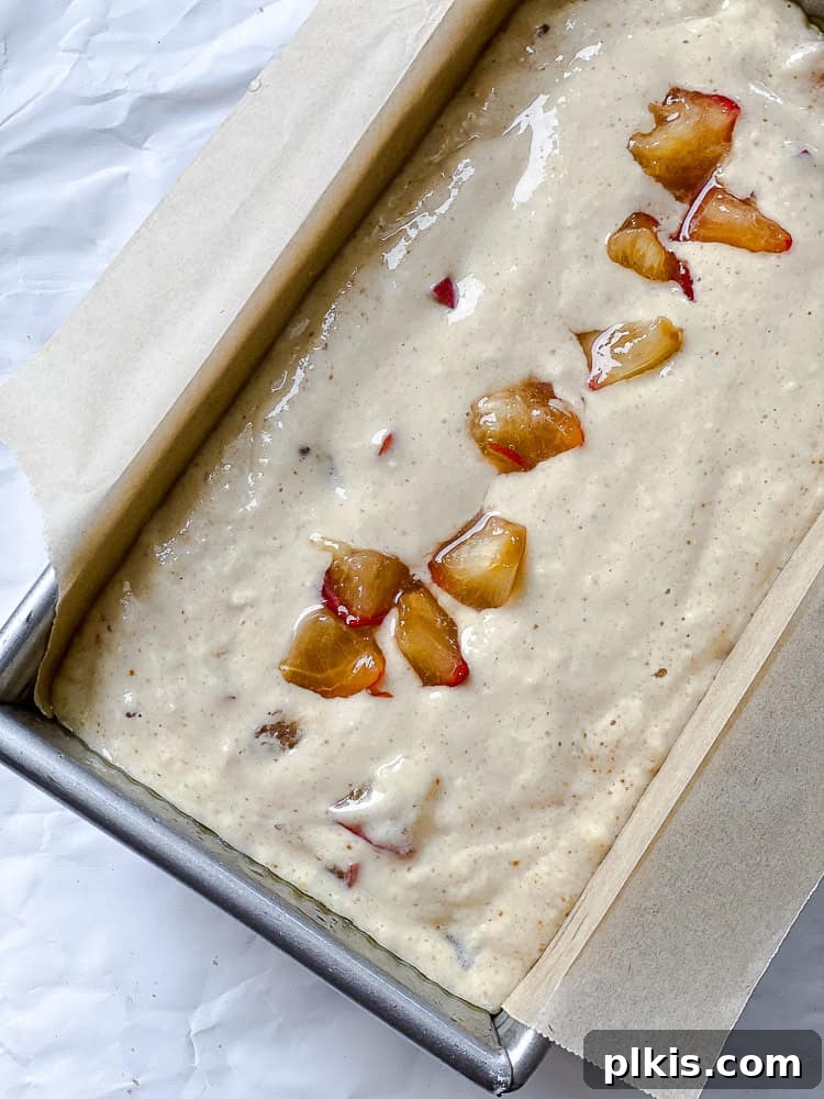 Golden Apricot Quick Bread 7 Process shot showing the completed apricot bread batter poured into the prepared loaf pan, ready for baking.