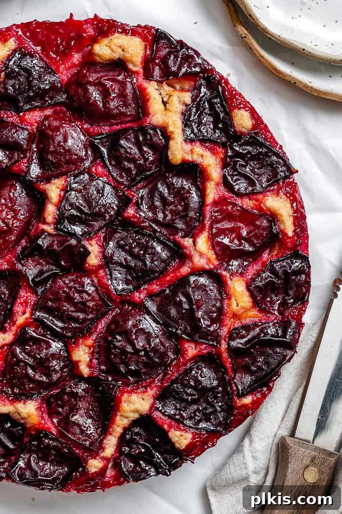Effortless Plum Perfection 2 completed Easy Plum Cake on a white surface