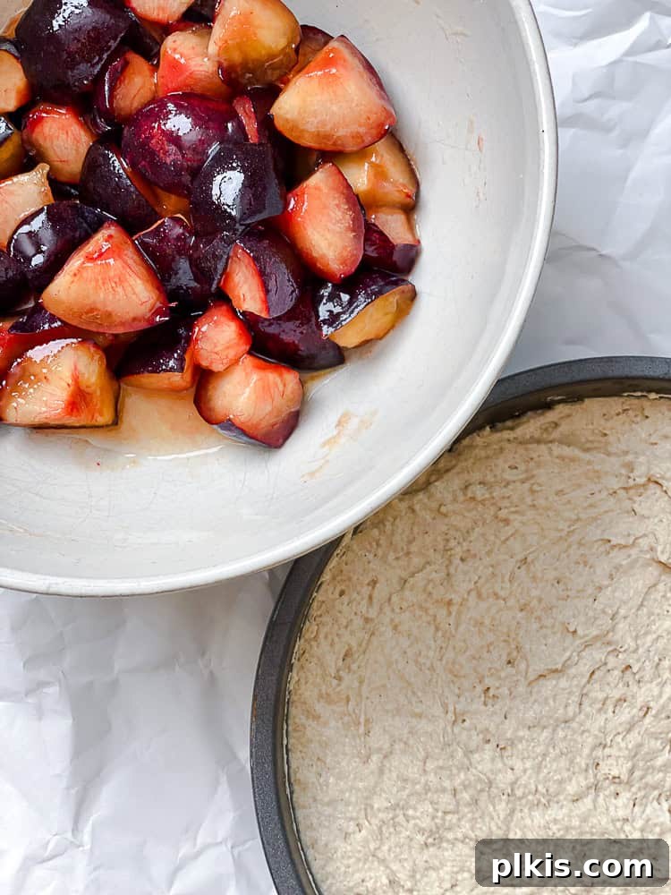Effortless Plum Perfection 7 process shot showing adding plum mixture to cake pan
