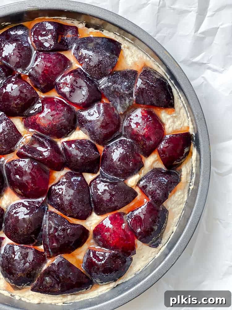 Effortless Plum Perfection 8 process shot showing pre-baked Easy Plum Cake in cake pan