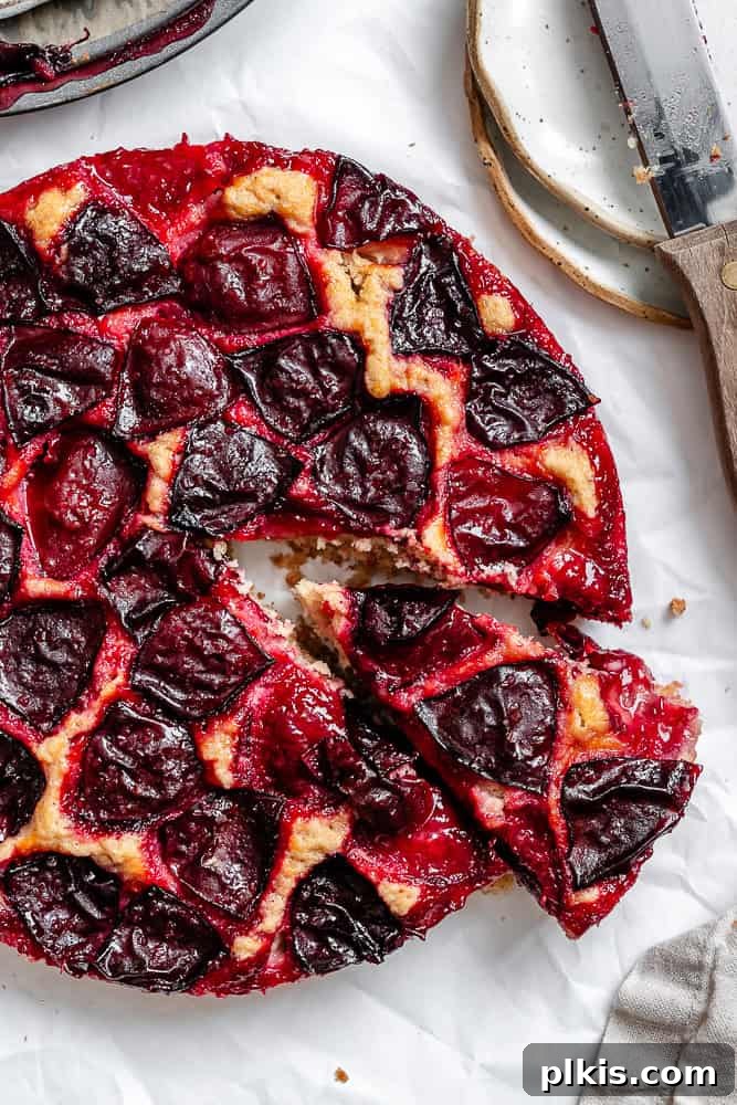Effortless Plum Perfection 9 completed Easy Plum Cake on a white surface