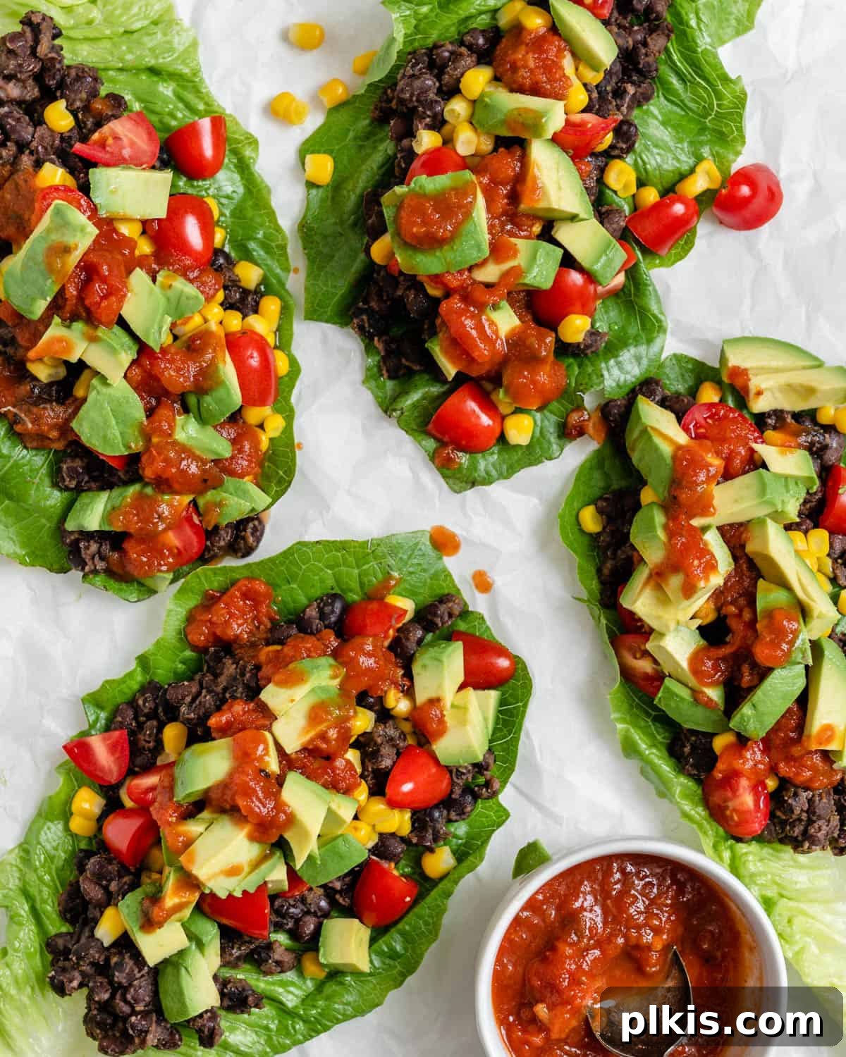 Zesty Black Bean Lettuce Cups 2 completed Vegan Black Bean Lettuce Wraps against a white surface