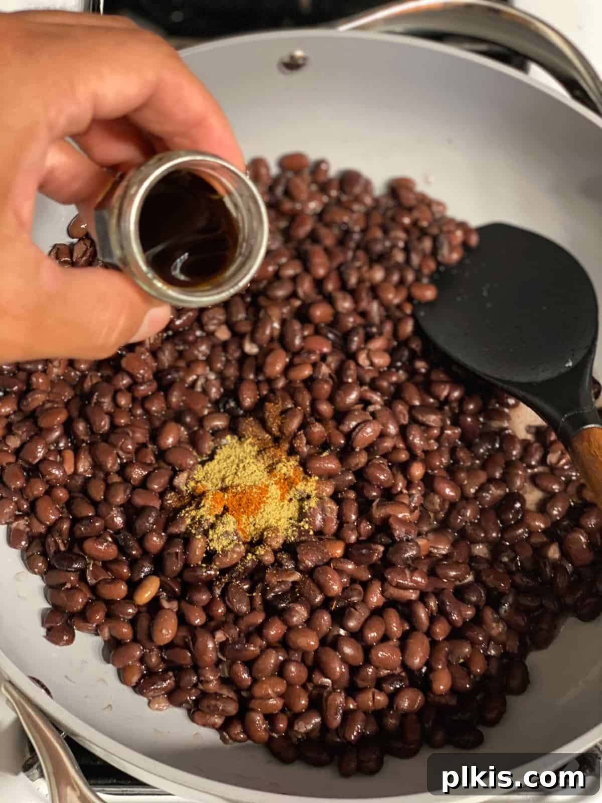 Zesty Black Bean Lettuce Cups 7 process shot of adding soy sauce to pan