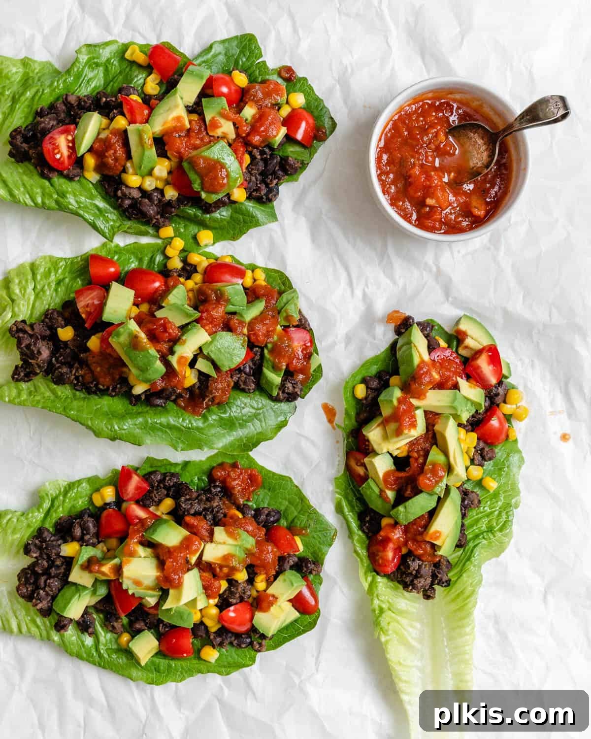 Zesty Black Bean Lettuce Cups 8 completed Vegan Black Bean Lettuce Wraps against a white surface