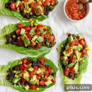 completed Vegan Black Bean Lettuce Wraps against a white surface