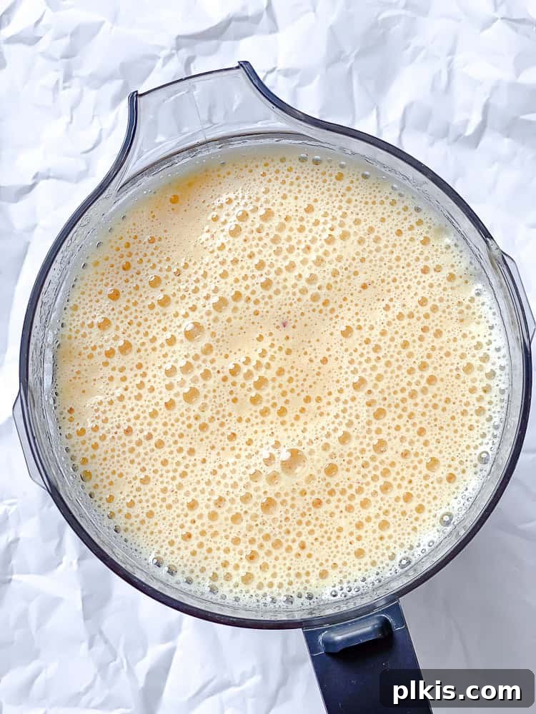 Golden Peach Lemonade 5 bubbly blended peach lemonade in a blender.
