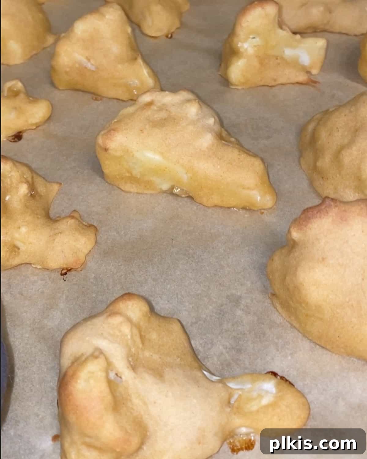 Process shot post baking cauliflower wings against parchment paper