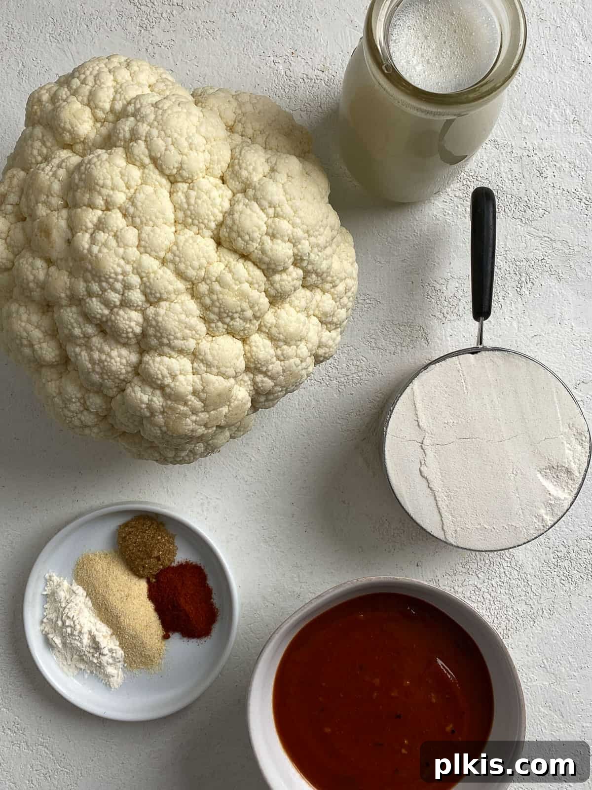 Ingredients for BBQ Cauliflower Wings measured out against a light background