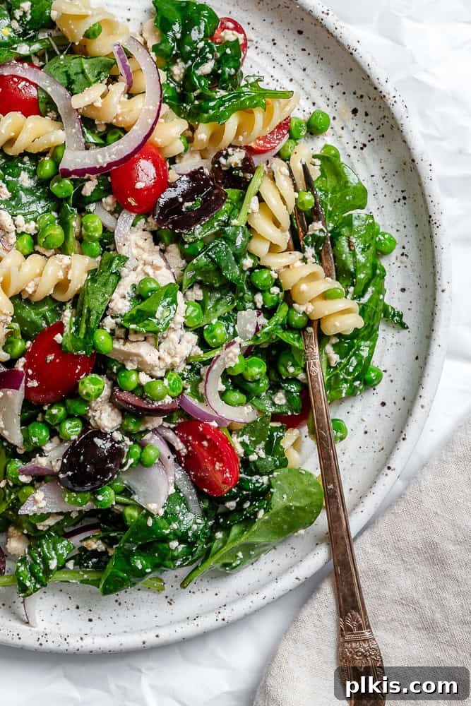Spinach Pasta Salad on a white plate.