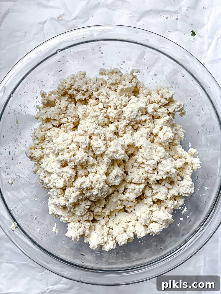 crumbled tofu in a large glass bowl.