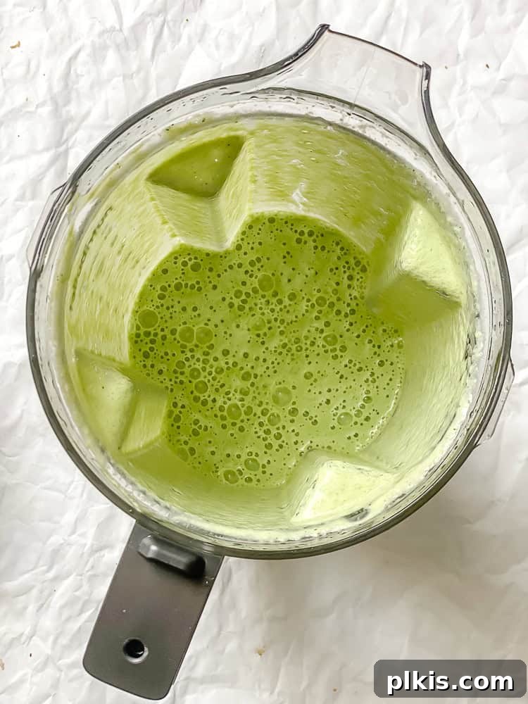 Cool Cucumber Delight 5 Process shot showing the blended ingredients for Cucumber Gazpacho, now smooth and creamy, inside the blender.